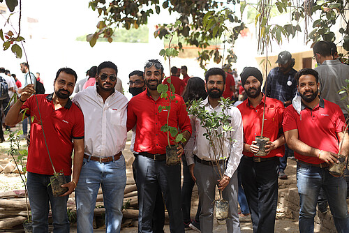 Photo: Hilti: Five people with plants in their hands