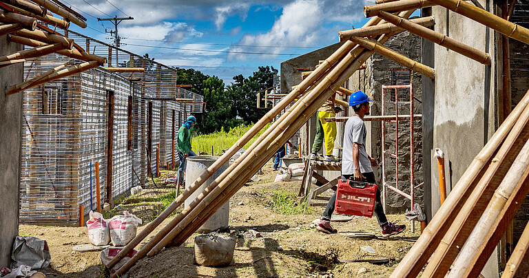Photo: Hilti: A worker walking with a Hilti case in a construction site
