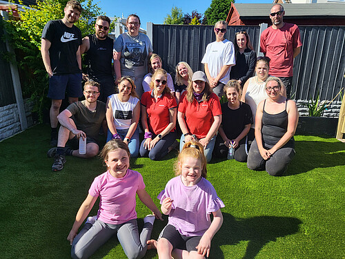 Photo: Hilti: A group of people and two children in a garden