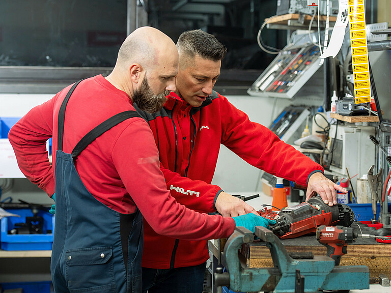 Photo: Hilti: Two people repairing in a factory