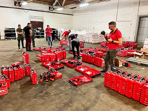 Photo: Hilti: Three people in front of a shelf full of shoes