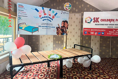 Photo: Hilti: A bed frame with baloons tied to it.