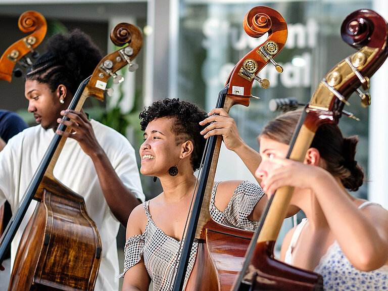 Photo: Hilti: 3 people playing contrabass