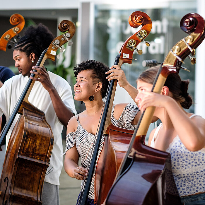 Photo: Hilti: 3 people playing contrabass