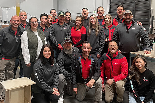 Photo: Hilti: A group of people in HILTI jackets smile for the camera.