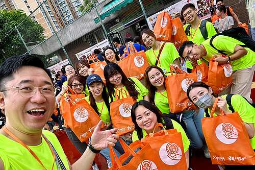 Photo: Hilti: Team members of Hilti Hong Kong holding orange gift bags