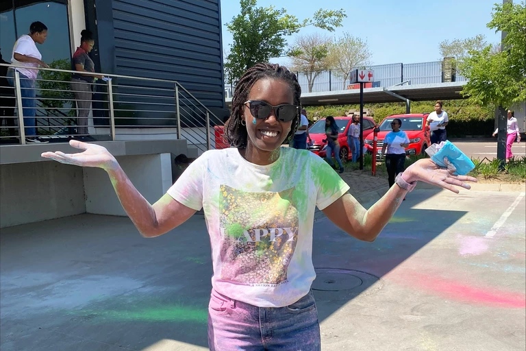 Photo: Hilti: A woman covered in color paint, smiling
