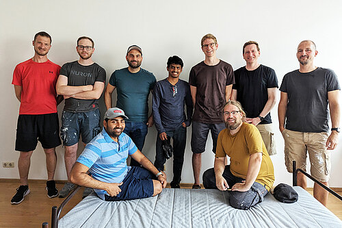 Photo: Hilti: A team of volunteers, two of them sitting on a bed