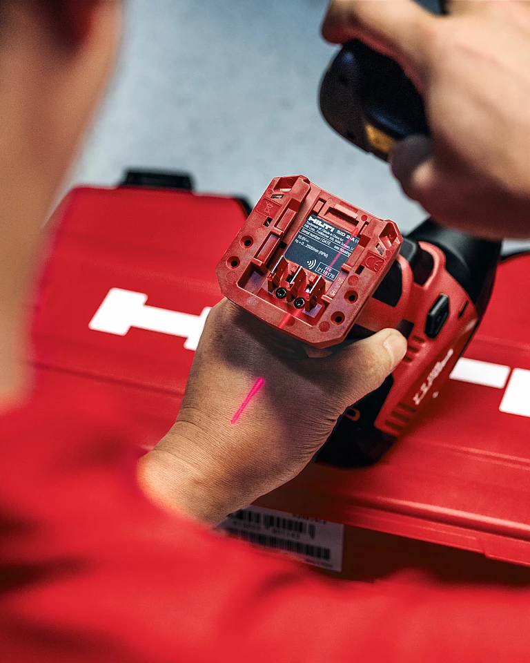 Inspection and testing of a new Hilti tool at the service center.