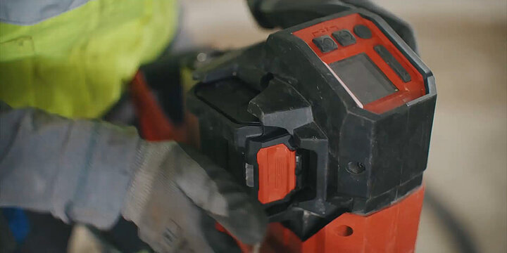 Construction workers using Hilti power up tools